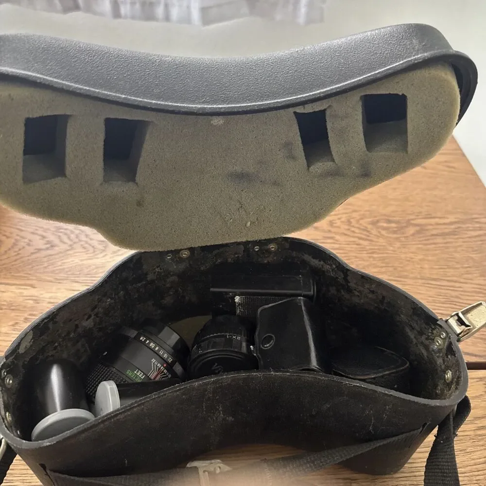 vintage Vivitar hard-sided black camera case And Vivitar camera accessory lot